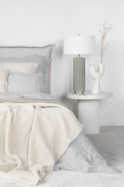istock Elegant lamp and decorative vase on bedside table 1470531608