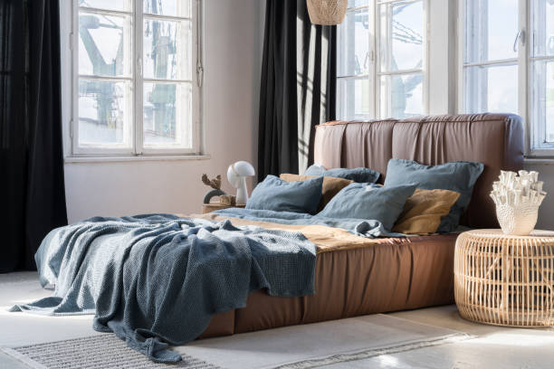 istock Bright bedroom with big bed and many windows 1470531657