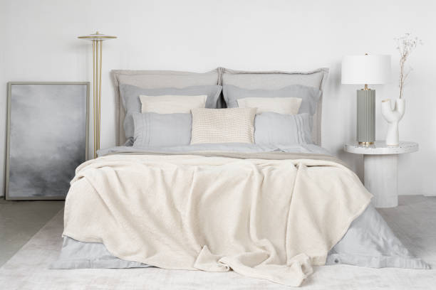 istock Bright and elegant bedroom with blue bedclothes 1470531675