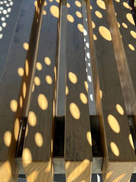 Circular Shadow on a Bench stock photo