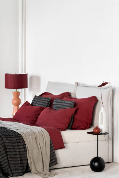 istock Simple white bedroom with vibrant colored decorations 1470531998