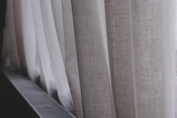 istock White linen curtain heating metal radiator background 1470534167