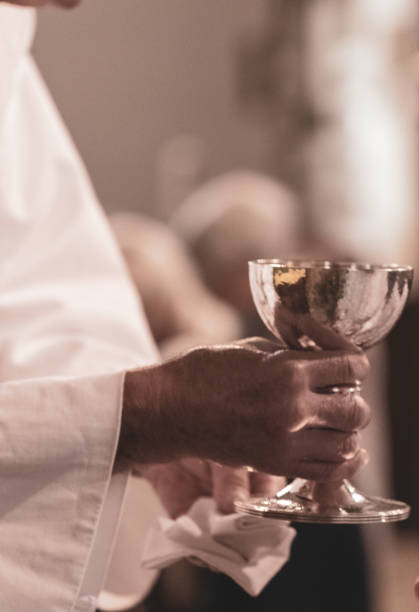 istock Clergy holding the communion chalice 1470534402