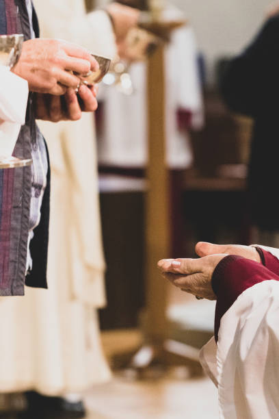 istock a person in robes recieving communion 1470534471