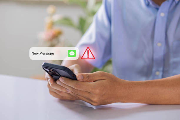 istock Businessman using smartphone with new message electronic email hacking and spam warning symbol. cyber attack network, virus, spyware, Cyber security and cybercrime. 1470537912