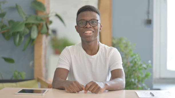 istock Young African Man Blogger Talking Online in Office 1470539268