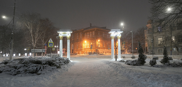 Beautiful path in a snowy night park, Armavir, Russia, Krasnodar region