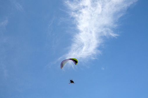 Paraglider. Flight against the background of the blue sky.