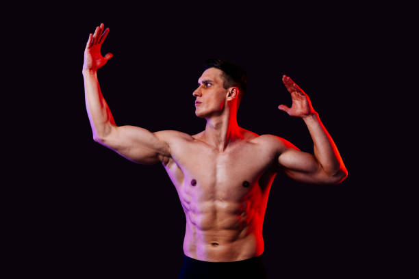 istock Athletic man with fit muscular body training in studio 1470542950