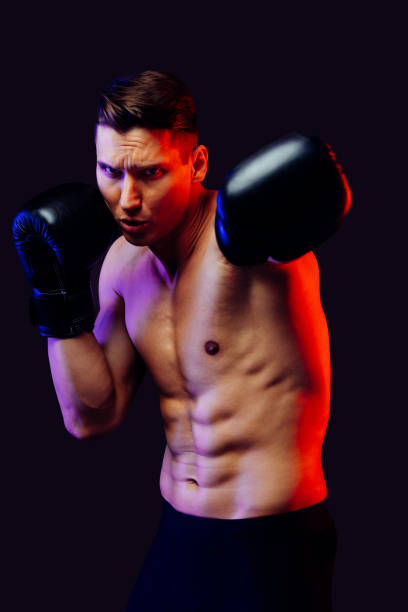 istock Athletic man with fit muscular body training in studio 1470543027