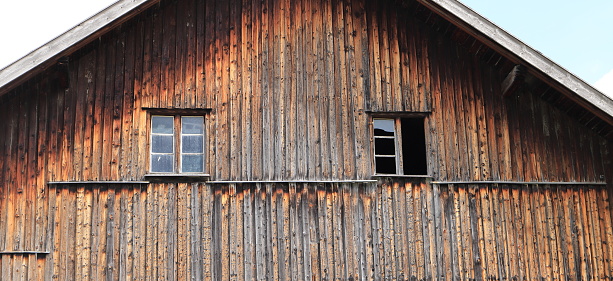 Weathered red paint and broken windows are a common site on barns in Vermont
