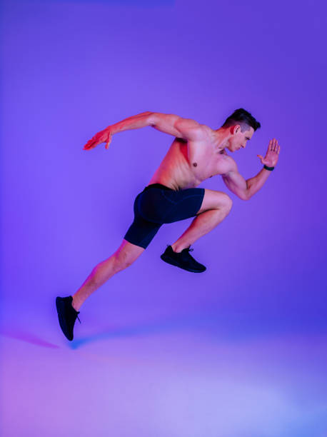 istock Athletic man with fit muscular body training in studio 1470543988