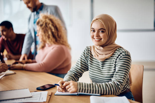 istock Happy Middle Eastern female student in the classroom looking at camera. 1470543989