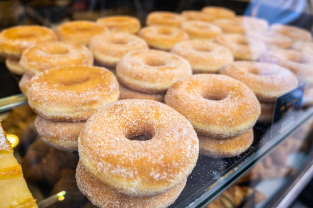 istock White glazed donuts in the window of a bakery. 1470545551
