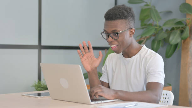 istock Online Video Chat on Laptop by Young African Man 1470545664