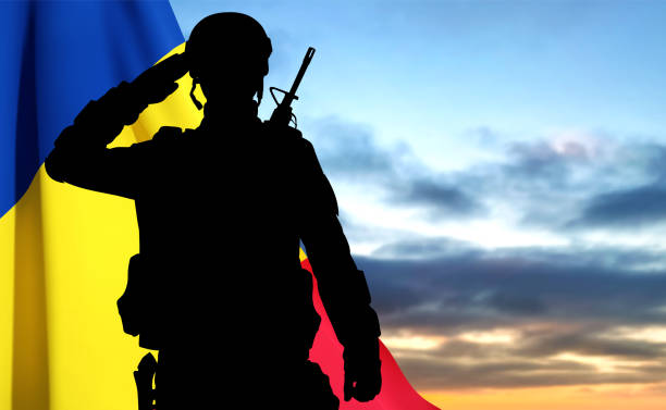 istock Silhouette of a saluting soldier with Romania flag 1470546623