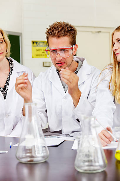 Lab trainee with safety glasses stock photo
