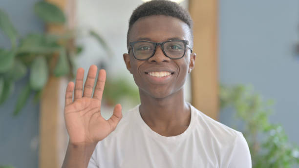 istock Young African Man Waving Hand to Say Hello For Video Call 1470547309