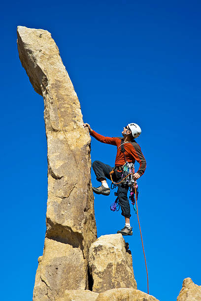 istock Rock climber nearing the summit. 147054771