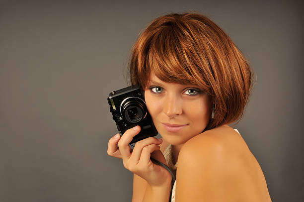 istock Beautiful Woman with Camera 147054835