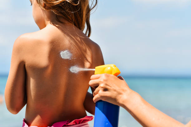 istock Mother applying suntan lotion on daughter 1470549322