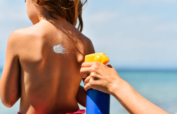 istock Mother applying suntan lotion on daughter 1470549480