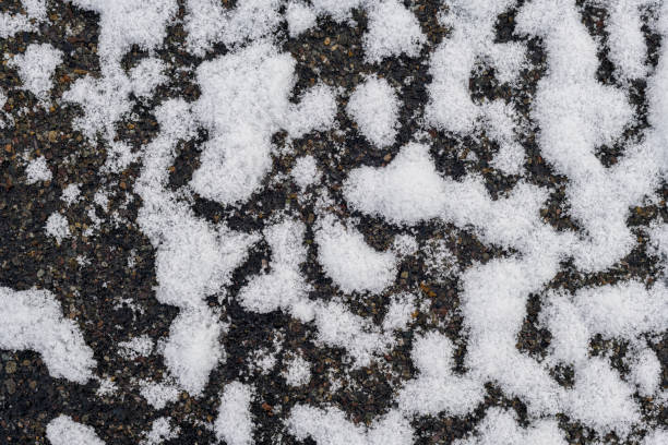 Abstract snow texture on a dark surface stock photo
