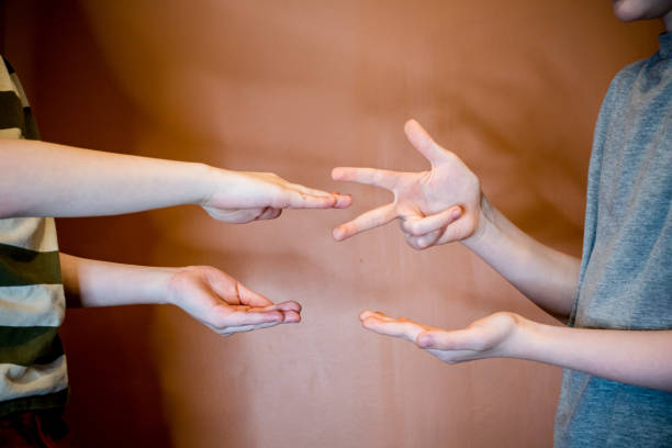 istock Rock-Paper-Scissors Battle: Boys Compete and Make Their Choices 1470551475