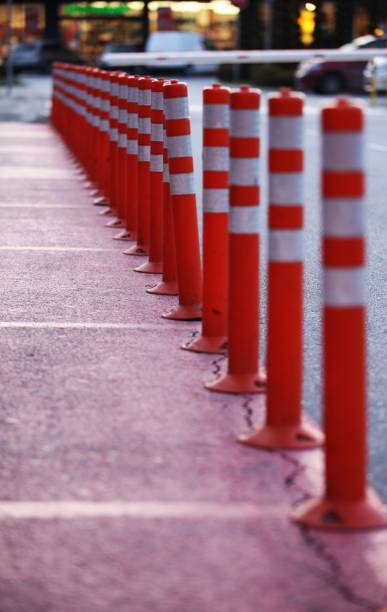 istock orange cones between the footpath and the carriageway 1470551730