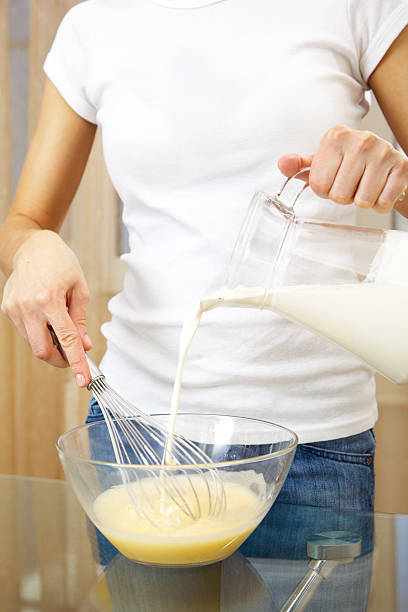 istock woman making egg-and-milk shake 147055243