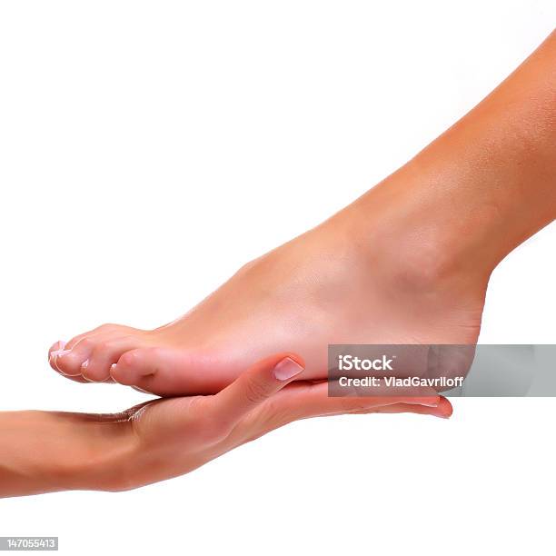 Foot Being Held In Palm Of Hand Isolated On White Stock Photo - Download Image Now - Beautiful Woman, Gripping, Sole Of Foot