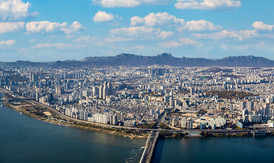 Aerial view overlooking the capital city of Seoul in South Korea and the Han River.