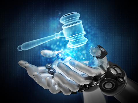 Blue gavel hologram over robotic hands. Cyber law concept.