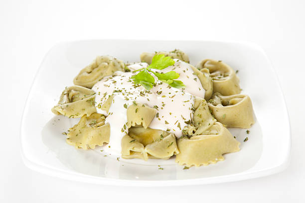 delicious dish of tortellini with cheese sauce and parsley