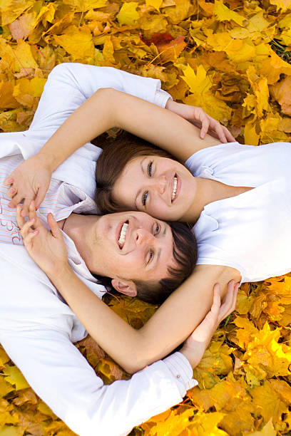 pair laying on leaves stock photo