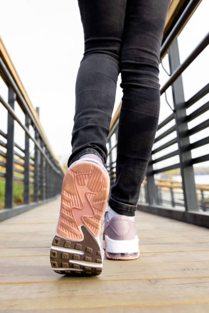 istock cropped image of female legs in shoes 1470557635