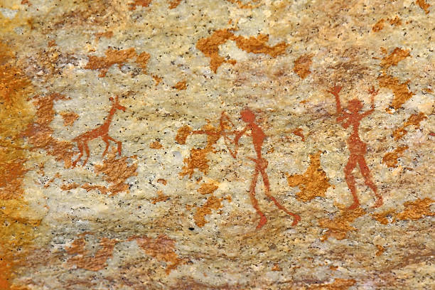 man and woman hunting animal bushman's tribal wall artwork stock photo