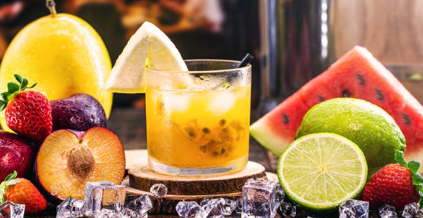 brazilian caipirinha, typical brazilian cocktail made with passion fruit, cachaça and sugar. traditional drink from brazil, isolated with space for text. - caipiroska imagens e fotografias de stock