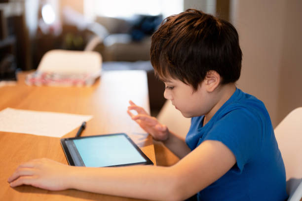 istock Education concept,School Kid learning online class room at home, Child using tablet for homework, Young boy studying online video call, E-learning or Home schooling,Kid Learning with New Technology 1470561149