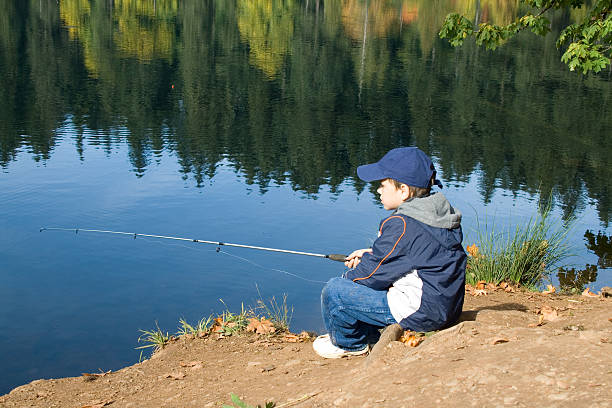 istock Cute 6 years old fisher boy 147056115
