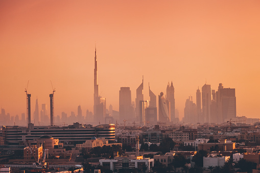 Dubai Business bay cityscape with skyscrapers at sunset time in UAE