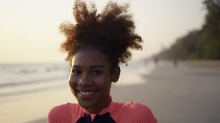 Close-up slow motion ,Black teenage girl at beach sunset ,Thailand.