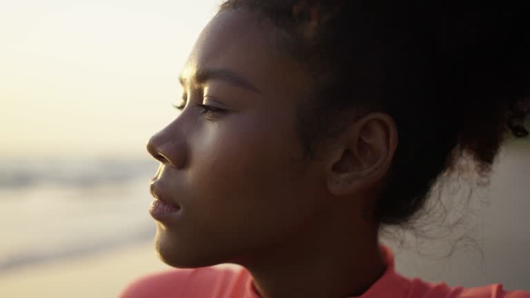 Close-up slow motion ,Black teenage girl at beach sunset ,Thailand.