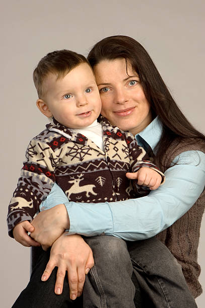 istock Smiling young mother with son 147056386