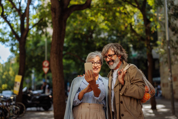 istock Senior couple taking selfie outside. 1470564680