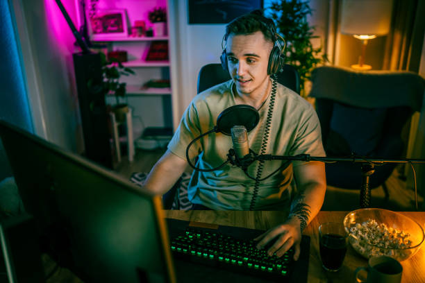 istock Young man male gamer playing computer game streaming video online 1470565961