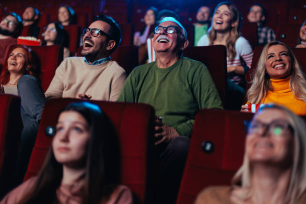 istock Diverse crowd in movie theater. 1470567477