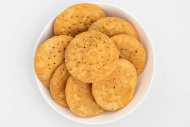 Photo of Namkeen Masala Mathri Also Called Matthi, Mathiya, Mathi, Farsi Poori, Farsan, Pharsa Or Mathari Is Famous Tea Time Gluten Free Snacks Consumed Mostly During Festivals Like Diwali, Holi, Karwa Chauth