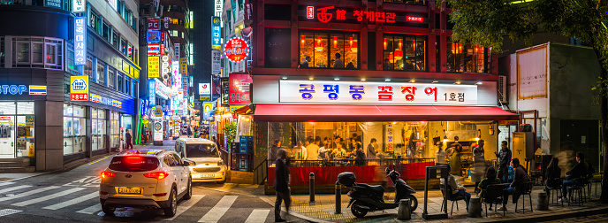 The busy night streets of downtown Seoul busy with people, shops and restaurants in the heart of South Korea’s vibrant capital city.