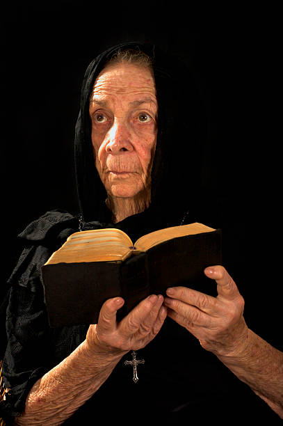 istock Beautiful Old Religious Woman 147056929